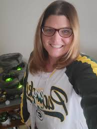 Wearing Badger sweatshirt and Packer hat to the game