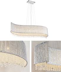 Wave is a ceiling lamp that charms with its unique lampshade in glass. Wave Suspended Ceiling Light With Crystals 112cm Long