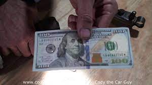 How to tell if new $100 bill is fake or real the new $100 bill is finally out and loaded with enhanced security features. How To Spot A Fake 100 Dollar Bill Youtube