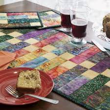 About Mccall S Quilting A Division Of Quilting Daily Table Runner Pattern Quilted Table Runners Lap Quilt Patterns