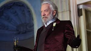 He always wears a midnight blue suit with small lightbulbs decorating it. Twitter Reacts To Hunger Games President Snow Prequel