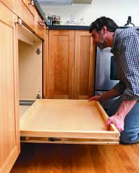 Attach the base plate to the base of the cabinet, using the predrilled holes and the short screws. How To Install A Pull Out Kitchen Shelf Pull Out Kitchen Shelves Kitchen Base Cabinets Diy Kitchen Cabinets