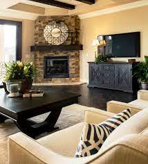 For example, center a curved sectional in front of a fireplace to provide a cozy spot to read and relax. Design Dilemma Arranging Furniture Around A Corner Fireplace Schneiderman S The Blog Design And Decorating