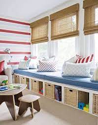 The ground floor was reorganized, and the existing carport/entry filled in, to make room for a multifunctional rumpus room for the kids, with large glass doors leading outside. Rumpus Room Storage Storage Kids Room Cozy Window Seat Big Boy Room