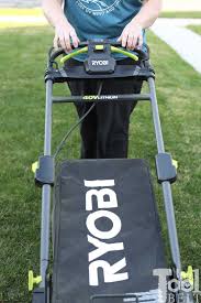 The ryobi electric riding lawn mower is delivered on a metal crate, covered in plastic that we had to cut away. Ryobi 40v Battery 21 Lawn Mower Review Her Tool Belt