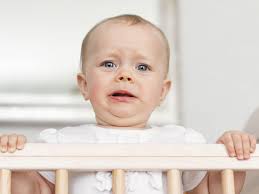 My six-month-old wakes at night and won't go back to sleep without a  breastfeed. What can I do?