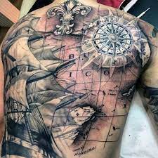 The nautical star is a symbol typically associated with sailors and is an extremely popular tattoo design. 50 World Map Tattoo Designs For Men Adventure The Globe Map Tattoos Pirate Map Tattoo Sleeve Pirate Ship Tattoos