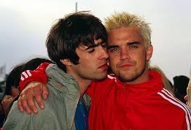 Robbie williams young take that. Robbie Williams Restarts Feud With Liam Gallagher By Making Fun Of Rocker S Moobs Mirror Online