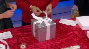 To make it fit without too much crunching, just take a few pieces of tissue, double them over at their middle until the height of the papers matches that of your box, then press them down into the base of the bottom half of the box. 15 Second Gift Wrap Hack To Try Now