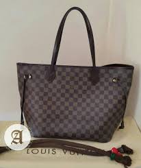 Louis Vuitton Black And Brown Checkered Purse Used Authentic Louis Vuitton Neverfull Damier Mm 2 750aed Like New Co Louis Vuitton Bag Neverfull Louis Vuitton Neverfull Louis Vuitton Neverfull Damier