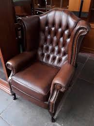 Lot Art A Brown Leather Chesterfield Wing Back Armchair