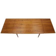 Extensions save space by tucking or folding neatly into a table, or being stored when they aren't needed. 1960s Extendable Dining Table 1stdibs