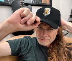 Dave holding glasses. Anyway, hello there, after about three weeks! Follow  @dave_mustaine_daily for more. #davemustaine #megadeth #davemustaineisgod  #davewroteemall #jameslomenzo #martyfriedman #nickmenza #kikoloureiro  #killingismybusiness #peacesells ...