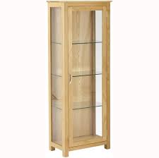 This impressive display cabinet is glazed on three sides making it perfect for your showing off your favorite ornaments and photos. New Progressive Oak Glass Display Cabinet Is Avaialble In Store Or Online