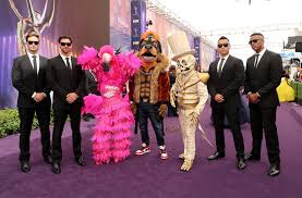 For example, who are the most likely type of celebrities to appear on a show like the masked singer? Masked Singer Penguin And Black Widow Revealed People Com