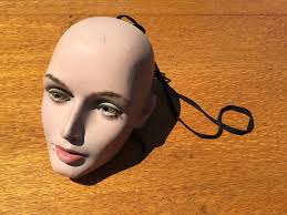 I found this at the local second hand store and I'm a bit puzzled over it's  use. It is not shaped to fit around my neck. Is it vintage or newer?