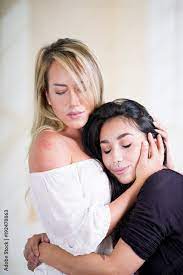 Sexy lesbians lovers in a room at morning, hugging each other, in a white  background Stock Photo | Adobe Stock