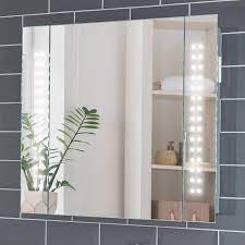 Alibaba offers 218 heated bathroom cabinets suppliers, and heated bathroom cabinets manufacturers, distributors, factories, companies. Pebble Grey Rowan Illuminated Led Bathroom Mirror Cabinet With Shaver Socket And Concealed Heated Demister Mirror Pad Motion Sensor Switch 650 X 600 Ip44 Rated 10 Year Guarantee