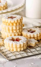 Same banana cookie recipe, served two different ways. Which do you prefer?  1- Banana Cookie topped with frosting and nuts? 2- Banana Whoopie Pies?  RECIPE: https://www.shugarysweets.com/banana-cookies/
