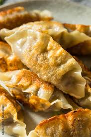In korea, mandu was traditionally made for celebratory occasions such as weddings and the new year. Homemade Korean Mandu Pork Dumplings Stock Photo Adobe Stock