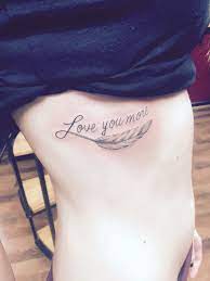 A bird tattoo is a symbol of freedom. Love You More Tattoo W Feather On Ribs Tattoos For Daughters Love You More Tattoo Rib Tattoo