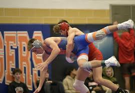 Port Clinton's Gavin Cornell tries to take Edison's Abe Hermes to the mat  in an entertaining 132-pound semifinal. Hermes won, 14-10.