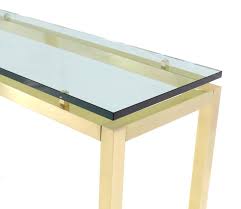 The sofa table is brass and glass, easy to maintain. Brass And Glass Console Table For Sale At 1stdibs