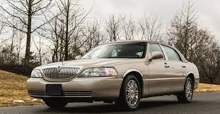 Image result for Medium Gold 1998 Town Car