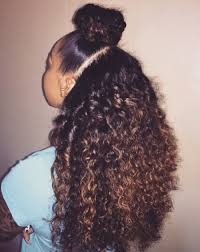 To get the look, brush all the hair above your ears straight. Half Bun Curly