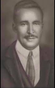 What is the origin of the clothing in the photo of Isadore Schaefer?