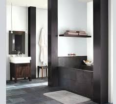 Powder bathroom located just off the entertainment room small classic sauna bathroom in seattle with shaker cabinets, brown cabinets, an alcove. Primary Bathroom Ideas