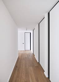 Modern Interior Doors From Floor To Ceiling With Minimal Black Door Frames And Vertical Built In Hand Doors Interior Doors Interior Modern White Interior Doors