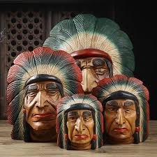 esculturas de caras madera