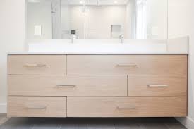 Along with log vanity, the hanging wood slab vanity is growing in popularity. White Oak Floating Vanity