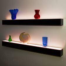 A hidden angled bracket mounts the shelf directly to the wall, where the decorative storage piece will slide down and lock into place. 1 Tier Led Floating Shelf Led Lighted Floating Bar Shelves Wall Mount