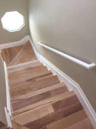 Natural Maple Wood Stairs White Baseboards Beach House Coastal Living Stairs Make Over Wood Stair Treads Wood Balusters White Baseboards