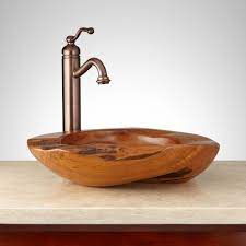 The bathroom with wood trim can be made in many styles. Bathroom Sink Material Buying Guide