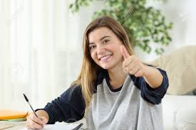 Happy Student Looking At You With Thumbs Up Sitting On The Floor.. Stock  Photo, Picture And Royalty Free Image. Image 69032813.