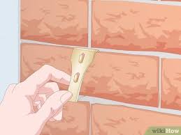 Hanging frames on brick is easy. 3 Simple Ways To Hang Garland On Brick Wikihow