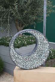 Have You Ever Heard Of Gabion Baskets Maybe Not Heard Of Them But Seen Them We Frequently See Them Used In Comme Garden Art Garden Art Sculptures Diy Garden