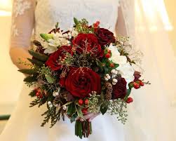 Below are some of the prettiest wedding bouquets for winter brides that we've come across. Winter Wedding Bouquet Ideas Red Rose Greenery White Small Mini Pinecones Winter Wedding Bouquet Neutral Wedding Flowers Flower Centerpieces Wedding