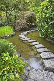 A Footpath From Stones Laid With Brick Through A Fine Pond In Water Features In The Garden Stone Garden Paths Landscaping With Rocks