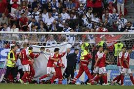 Denmark's christian eriksen is taken away on a stretcher after collapsing on the pitch during the euro 2020 soccer championship group b match between denmark and finland at parken stadium in. P53br3oxxavbbm