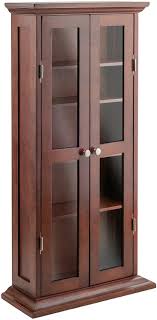 Shop for cd/dvd storage in tv stands & entertainment centers. Winsome Wood Cd Dvd Cabinet With Glass Doors Antique Walnut Amazon Ca Home Kitchen