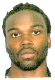 One jailed, another sought in brutal beating