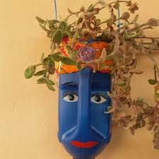 Carefully cut your plastic milk bottles to the depth you require and drill a few holes in the base for drainage. Milk Jug Planters With Faces Eco Friendly Diy Ideas Balcony Decoration Eco Friendly Garden Ideas