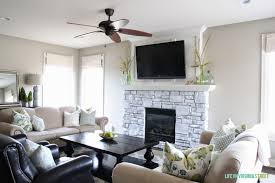 After the stone fireplace surround is clean, get out your water bottle and spray the rocks. A White Washed Stone Fireplace Tutorial Life On Virginia Street