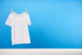 Maybe you would like to learn more about one of these? Clean White T Shirt Hanging On Rope On Blue Free Stock Photo And Image
