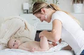 But, let's be real here. Young Mother Changing Her Baby Boy S Diaper Stock Photo Picture And Royalty Free Image Image 81122033