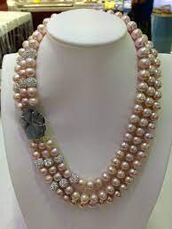 Triple Strand Pink Freshwater Pearl Necklace With A Large Shell Flower Necklace Coat Fa Pearl Necklace Designs Beautiful Gold Necklaces Gold Jewelry Stores